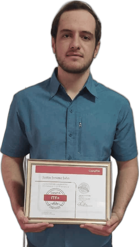 Justin John holding his certificate